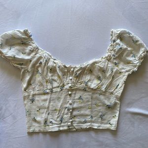 Forever 21 White top blouse with small blue and yellow flowers.